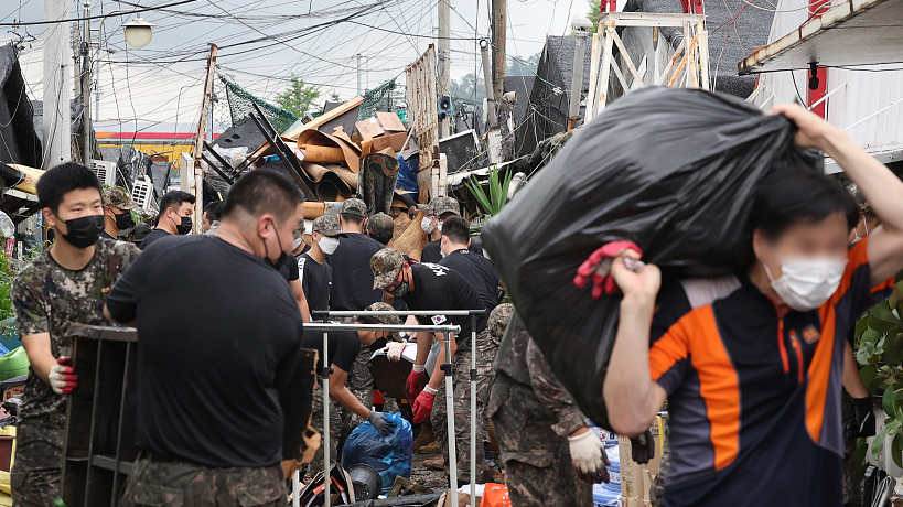 11 die in heavy rains in South Korea and more